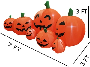 Macro detail of 7FT inflatable Halloween pumpkins with diverse spooky faces and green stems