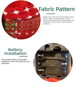 Detail of red flannel fabric texture and battery compartment for electric Santa doll