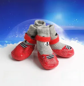 Detail of red anti-slip silicone sole and knit fabric on adjustable pet socks