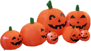 Set of 7 inflatable Halloween Jack-o'-lantern pumpkins in various sizes for decor