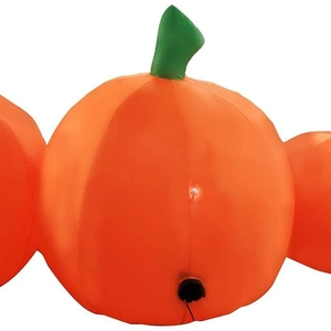 Inflatable orange Halloween pumpkin decoration with internal LED light for outdoor festive setup