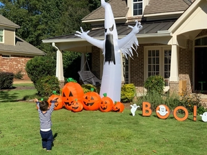 Inflatable Halloween ghost with pumpkins and BOO sign for outdoor lawn garden decor