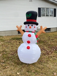 Detail of a 1.6m inflatable snowman Christmas outdoor decoration with built-in LED lighting