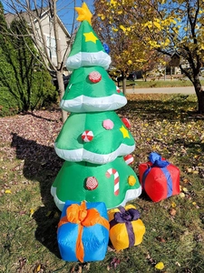 2.1M inflatable Christmas tree with star topper and colorful gift boxes in outdoor garden