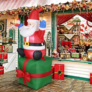 1.8m inflatable Santa Claus on a green gift box for outdoor Christmas yard decoration