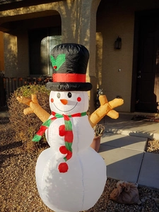 Outdoor 1.6m inflatable Christmas snowman with scarf and branch arms on a front porch
