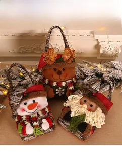 Detailed view of Christmas gift bags featuring plush Santa, Snowman, and Reindeer designs
