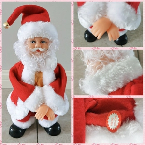 Detail view of electric Santa Claus plush toy with musical on-off switch feature