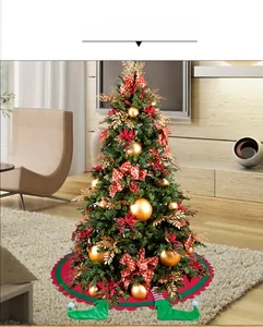 Detail view of red and green Christmas tree skirt with elf feet boots and wavy edge design