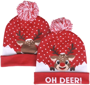Close-up of red Christmas knit hats with white pom-pom and reindeer pattern detail