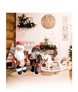 Detail of Santa Claus figurines in classic red and grey winter outfits for Christmas decor