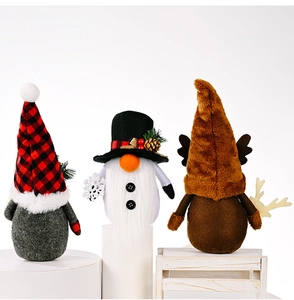 Detailed view of three festive Christmas gnomes featuring plaid hats and reindeer antlers