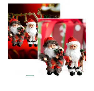 Detail of two musical dancing Santa Claus dolls with festive gift bags and fur trim