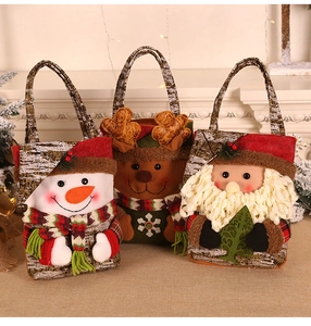 Detail of Christmas gift bags featuring plush Santa, reindeer, and snowman 3D characters
