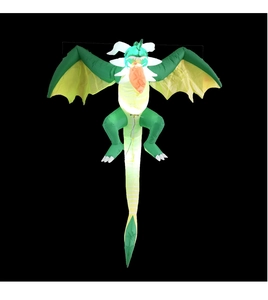 Macro view of inflatable Halloween dragon with glowing belly and yellow wings for outdoor use