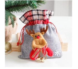 Christmas burlap gift bag with plush reindeer, red plaid trim and golden bells detail