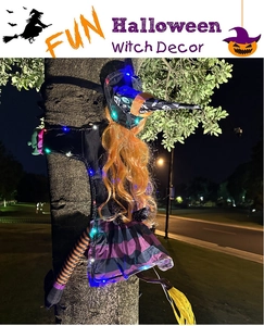 Outdoor Halloween tree-crashing witch with glowing LED lights and bright orange hair