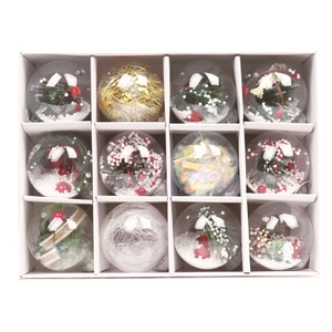 Set of 12 clear Christmas ball ornaments with pine needles and red berries in a box