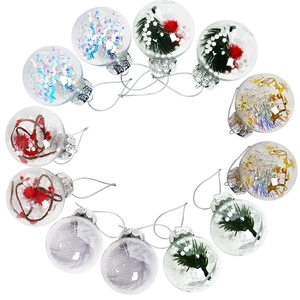 Set of 12 clear plastic Christmas ornaments with pine needles and festive holiday fillers