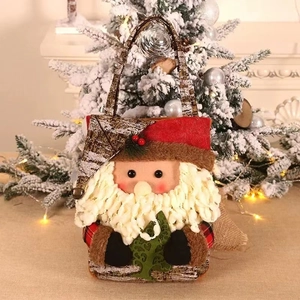 Christmas gift bag with 3D Santa Claus design and green tree detail for holiday gifts