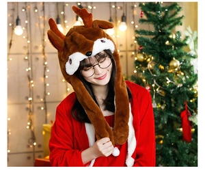 Close-up of reindeer plush hat with 3D antlers and long ear flaps for Christmas decor