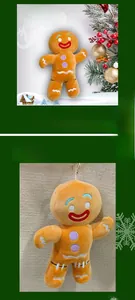 Close-up of plush gingerbread man toy with embroidery and metal hanging chain