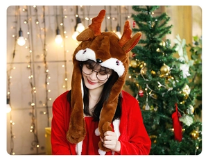 Close-up of reindeer plush hat with moving ears and embroidery in Christmas setting