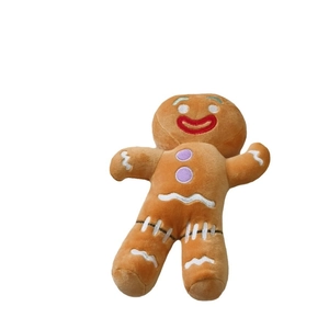 Cute gingerbread man plush toy with soft brown fabric and festive white wavy details