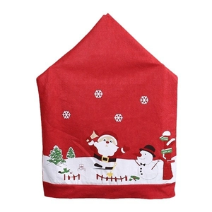 Festive red non-woven Santa Claus chair covers with snow scene and Christmas tree prints