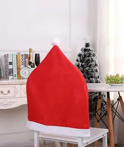 Close-up of a festive red non-woven Christmas hat chair cover with white plush trim