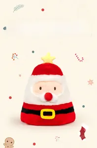 Close-up of reversible Santa plush hat with yellow star and festive hand-drawn background