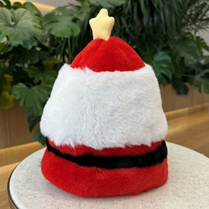 Detail of plush reversible Santa hat featuring a yellow star topper and soft velvet texture