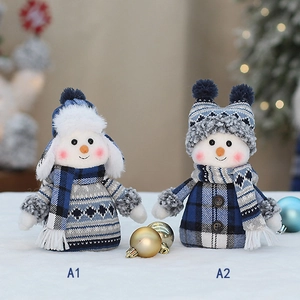 Plush Christmas snowman dolls in blue knit outfits with festive holiday decorations