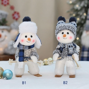 Blue fabric snowman figurines with skiing gear for Christmas holiday home decorations