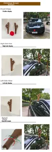 Detail of plush brown reindeer antlers and red nose set installed on a luxury car