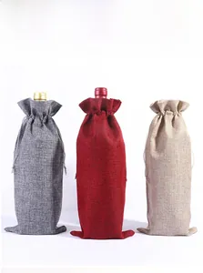 Three-piece burlap wine bottle gift bags in dark grey, dark red, and cream white colors