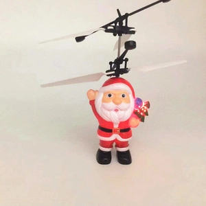 Macro view of flying Santa drone toy with glowing LED light ball and dual rotors