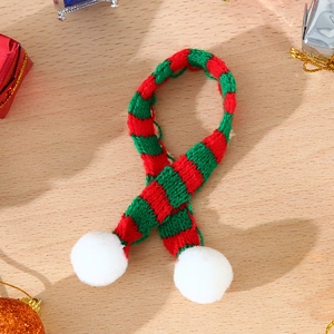 Mini Christmas knitted scarf with red green stripes and white pom-poms for festive decor