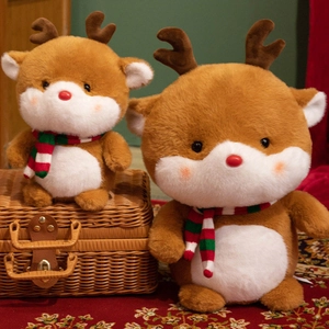 Christmas reindeer plush toy set with red noses and striped scarves in warm indoor setting