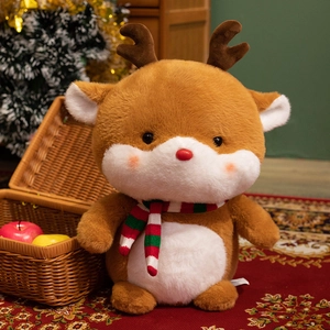 Plush Christmas reindeer doll with a striped knit scarf in a festive home setting