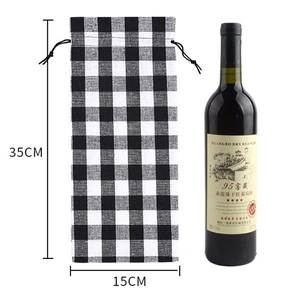 Detailed size view of black and white checkered wine bottle bag, 35cm high and 15cm wide