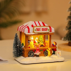 Scultura luminosa del negozio di giocattoli di Natale con Babbo Natale e musica