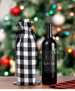 Close-up of black and white buffalo plaid cotton wine bottle gift bag with drawstring