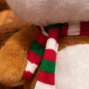 Charming plush Christmas reindeer doll with striped knit scarf in a cozy woven basket