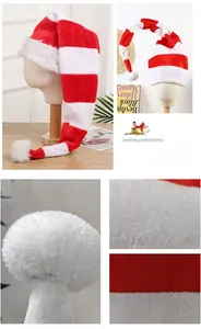 Detailed view of red and white striped plush fabric and fluffy pom-pom on Christmas hat