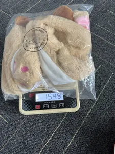 Logistics detail of plush reindeer hat showing packaging dimensions 25x25x5cm and weight