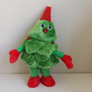 Macro view of electric singing Christmas tree plush toy with red gloves and boots