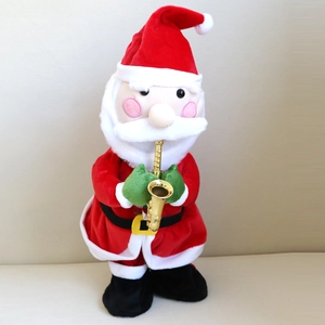 Close-up of plush Santa Claus electric toy playing a golden saxophone for Christmas
