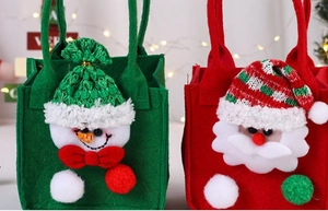 Close-up of felt Christmas gift bags with 3D Santa and Snowman embroidery details