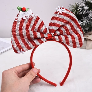 Weihnachtshaarreif mit großer rot-weiß gestreifter Glitzerschleife und Merry Christmas Schild